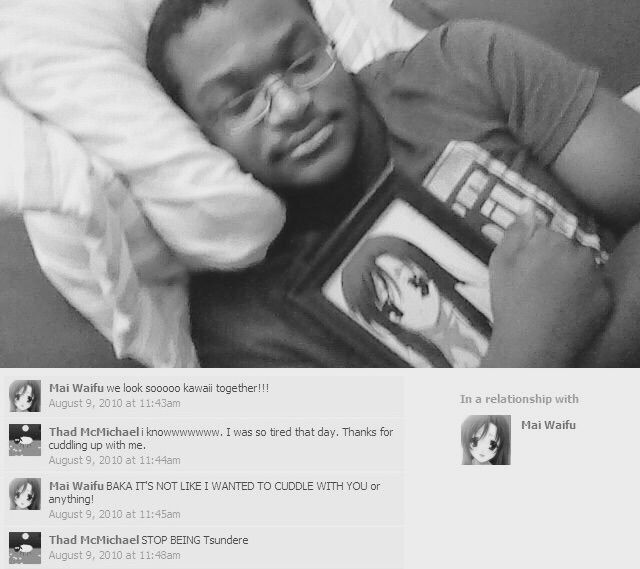 Otaku sleeping with his waifu